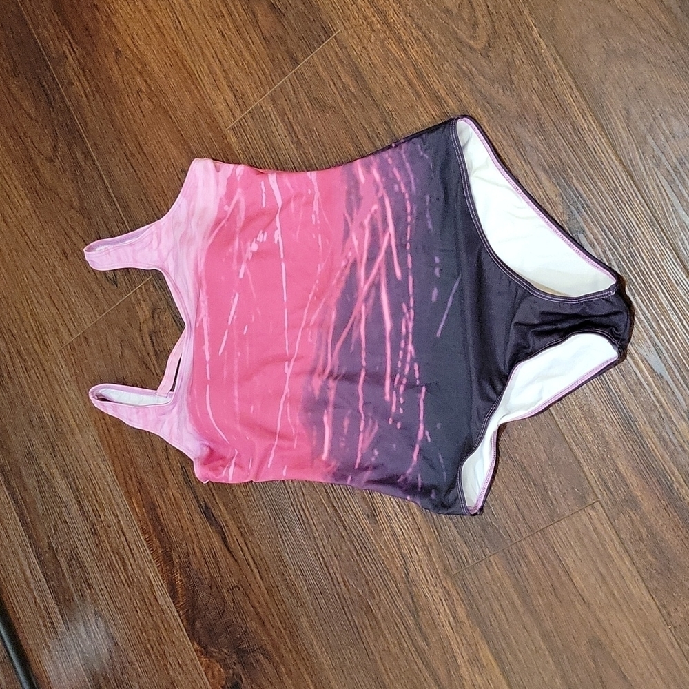 XL one piece pink and purple swimsuit. Criss-cross back NWOT